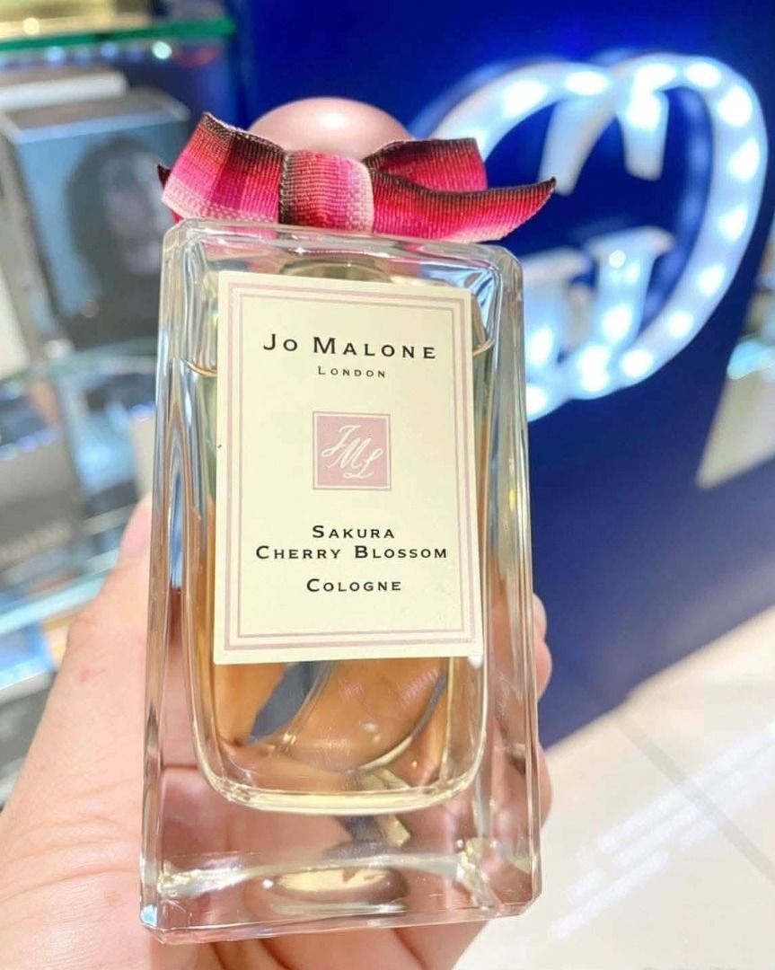 Jo Malone Sakura Cherry Blossom Cologne (Category: Fragrance & Deodorants) located in Manila. Submitted by selling.essentials (Listing ID 1463875422, Image 1). Description: - Jo Malone London Sakura Cherry Blossom Cologne - Light pinkish liquid in clear glass bottle - Features signature ribbon detail - Lovely floral scent - Ideal for gifting or personal use.