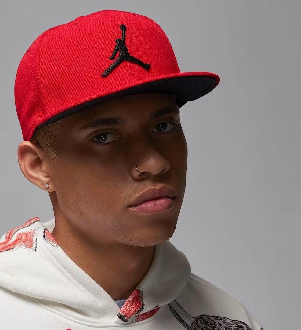 Jordan Red Snapback Cap Black Jumpman Logo (Category: Caps & Hats) located in Agdangan. Submitted by chano11339 (Listing ID 1463844951, Image 2). Description: - Classic red Jordan snapback - Black Jumpman logo on the front - Adjustable strap for a comfortable fit - Interior features 'Quality Inspired by the Greatest Player Ever' taping - Ideal for any fan of Michael Jordan.