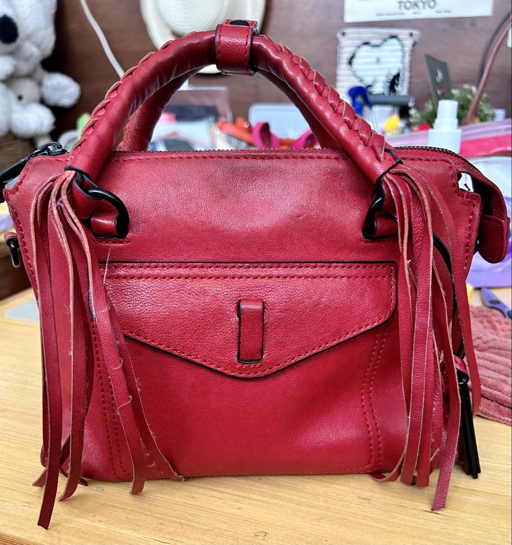 JOY GRYSON natalie (Category: Shoulder Bags) located in Quezon City. Submitted by asiaco (Listing ID 1463778493, Image 1). Description: Chic red leather GRYSON handbag with braided handles and fringe details. Includes a detachable shoulder strap and zipper closure. Perfect for day or night.no flaws, only preloved signs of usage. .