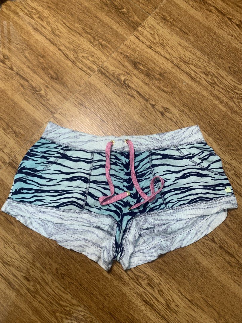 Juicy Couture Tiger Print Shorts with Pink Drawstring (Category: Shorts) located in Davao. Submitted by legitseller1111 (Listing ID 1463783578, Image 1). Description: - Cute Juicy Couture shorts -Size Xs ( Size 28 Adjustable) - Blue and black tiger print - Comfortable elastic waistband - Sparkly pink drawstring - Raw edge hem finish - Small gold 'JUICY' heart charm near hem - Ideal for lounging or casual wear.