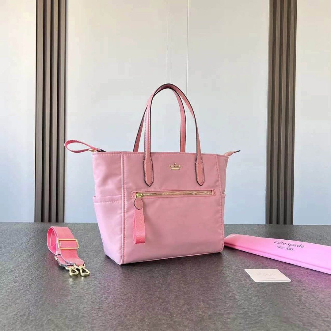 Kate Spade Chelsea Tote Bag Medium (Category: Tote Bags) located in Abucay. Submitted by erindeclutterss (Listing ID 1463858508, Image 1). Description: - Material: Nylon with leather trim - Closure: Zip top - Exterior: Zip pocket - Interior: Slip pockets - Strap: Detachable shoulder strap - Hardware: Gold-tone - Ideal for: Everyday use.