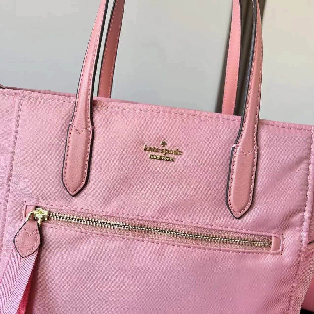 Kate Spade Chelsea Tote Bag Medium (Category: Tote Bags) located in Abucay. Submitted by erindeclutterss (Listing ID 1463858508, Image 2). Description: - Material: Nylon with leather trim - Closure: Zip top - Exterior: Zip pocket - Interior: Slip pockets - Strap: Detachable shoulder strap - Hardware: Gold-tone - Ideal for: Everyday use.