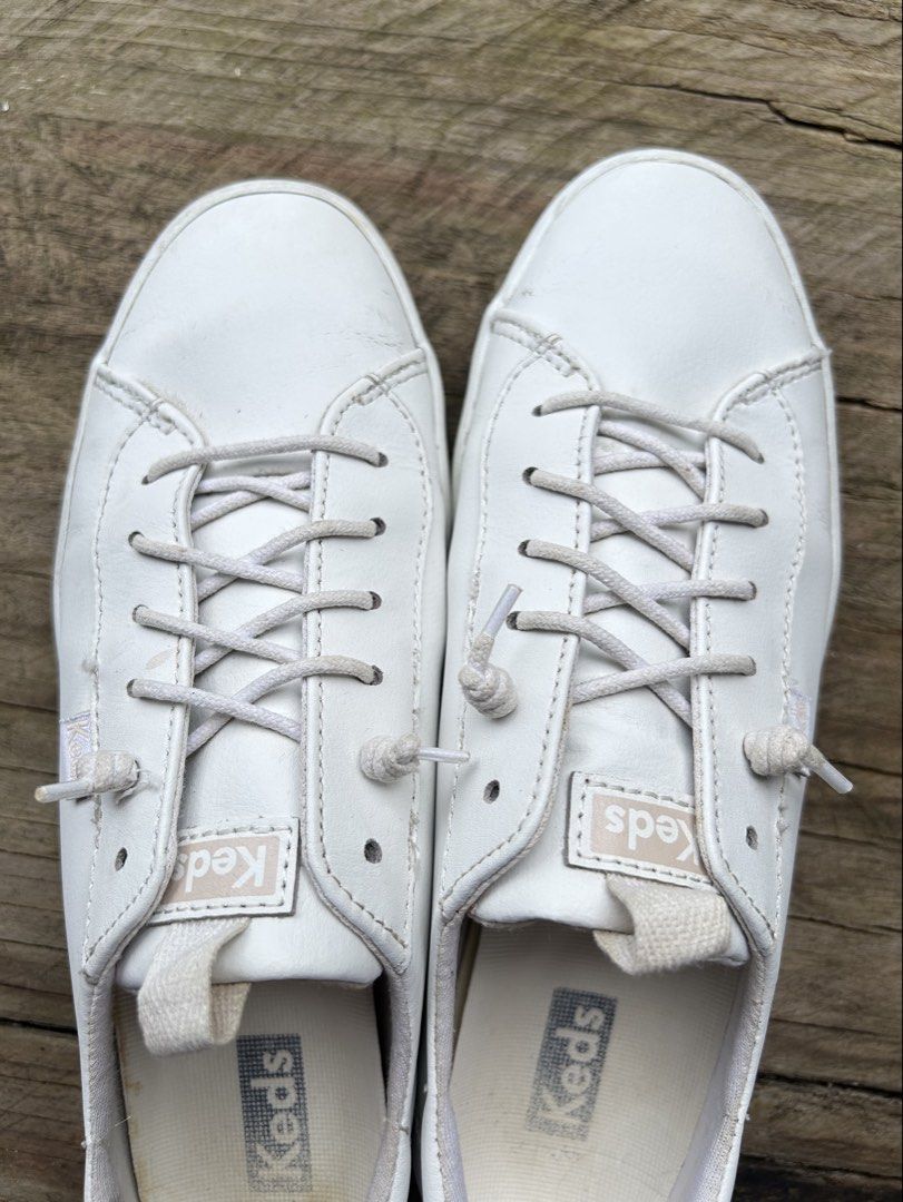 Keds White Leather Lace-Up Sneakers (Category: Sneakers) located in Baguio. Submitted by tresmariascloset13 (Listing ID 1463773855, Image 3). Description: - Classic white leather Keds sneakers - Comfortable lace-up style for everyday wear - Minor scuffs on soles and slight creasing on leather - Size USA8 Please check images for flaws.