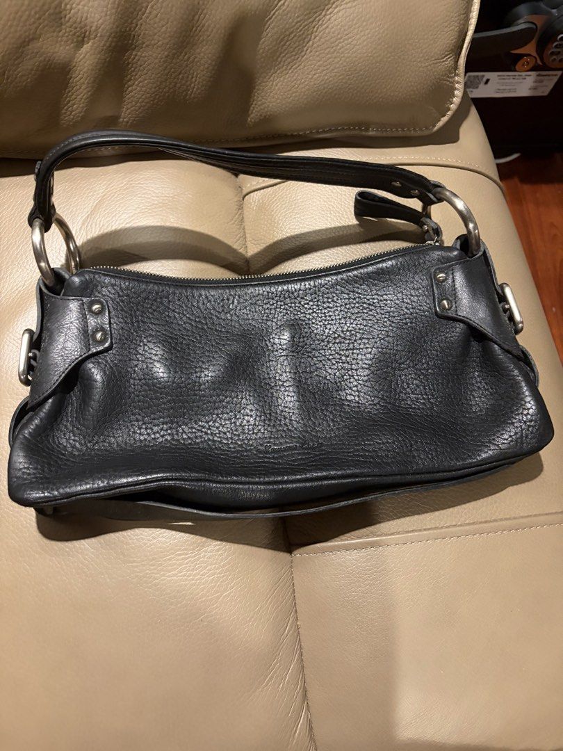 Kenneth Cole Black Leather Shoulder Bag (Category: Shoulder Bags) located in Quezon City. Submitted by yarnhillmanila (Listing ID 1463866520, Image 1). Description: - Brand: Kenneth Cole - Color: Black - Material: Leather - Texture: Pebbled - Hardware: Silver - Closure: Zipper - Style: Classic, versatile for everyday wear.