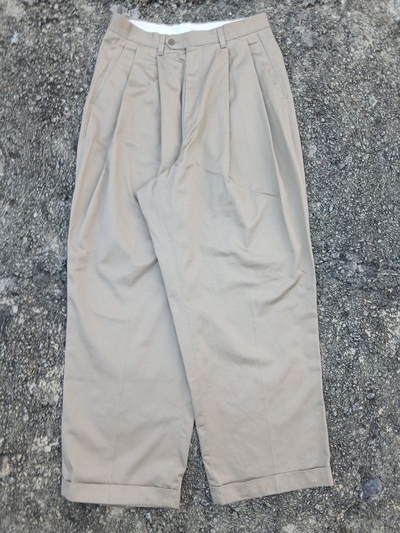 Khaki Pleated Trousers (Category: Trousers) located in Caloocan City. Submitted by answery (Listing ID 1463834183, Image 3). Description: - Classic khaki trousers - Front pleats for a tailored look - Cuffed hems - Button and zip closure - Two back pockets - Ideal for smart casual or work attire - Comfortable fit.
