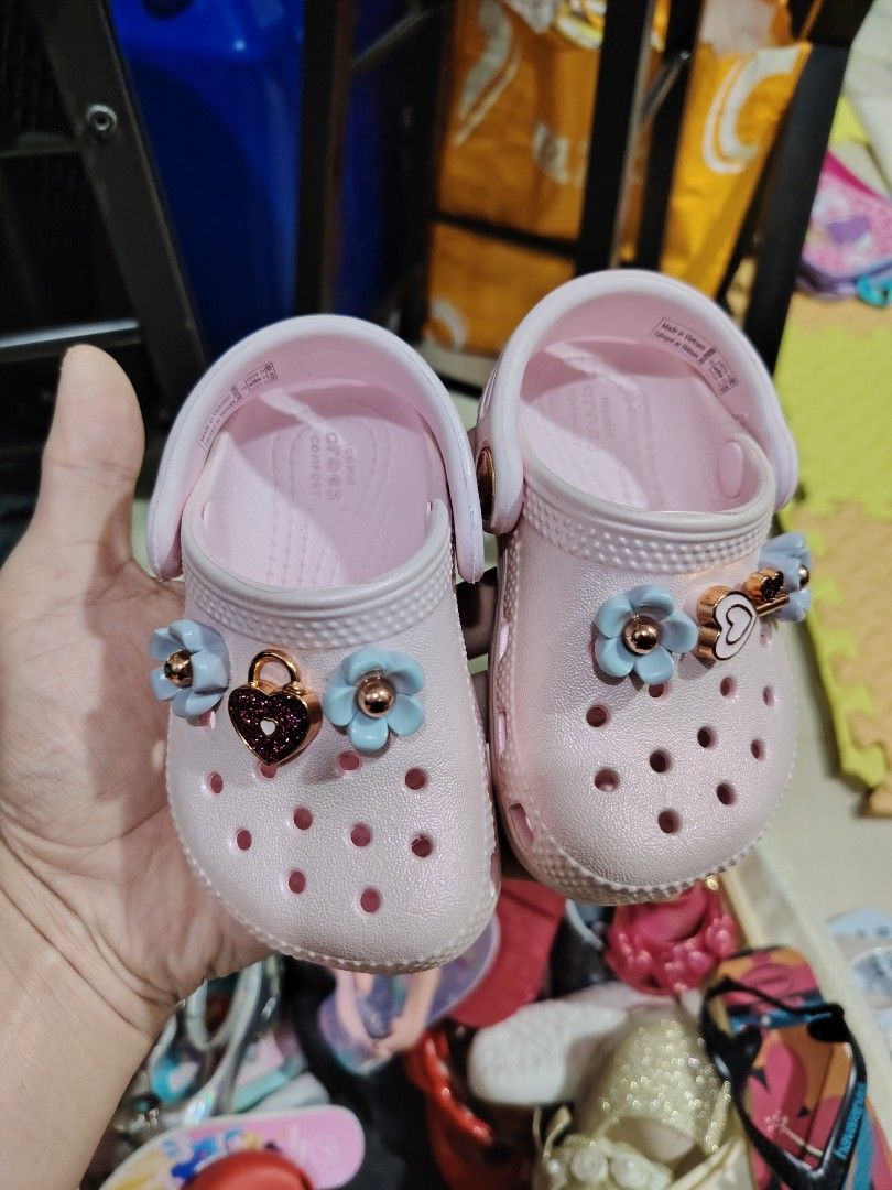 Kids Pink Crocs with Charms (Category: Babies & Kids Fashion) located in Makati City. Submitted by jayclutter0976004 (Listing ID 1463827615, Image 1). Description: - Adorable pink Crocs for kids - Comes with cute flower and heart charms - Easy slip-on design for little feet - Ideal for playtime and everyday casual wear - Made in Vietnam.