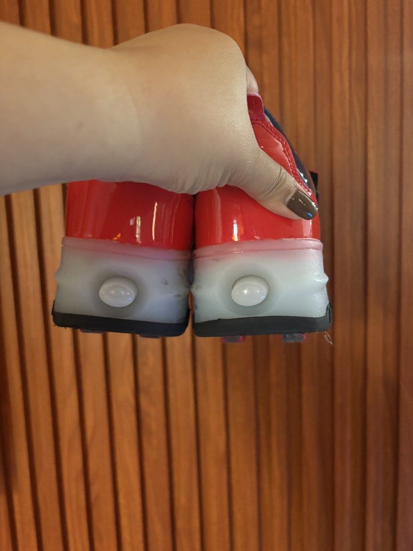 Kids Roller Shoes with Wheels & lights (Category: Babies & Kids Fashion) located in Manila. Submitted by tindahan_ni.alingnena (Listing ID 1463778042, Image 3). Description: - Stylish black and red roller shoes for kids. - Secure velcro strap closure. - Built-in wheels for easy rolling. - Features a cool graphic on the side (possibly Optimus Prime). - Ideal for active play and outdoor fun. Size 38 With lights Rechargeable.