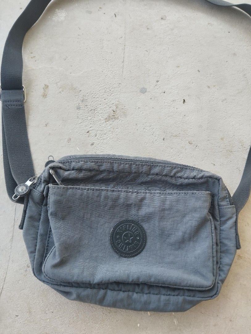 Kipling Grey Nylon Crossbody Bag (Category: Cross-body Bags) located in Mati. Submitted by old_era.ph (Listing ID 1463789570, Image 3). Description: - Grey Kipling crossbody bag - Made of durable nylon - Features a front zipper pocket - Main compartment with zipper closure - Adjustable strap for comfortable wear - Small and compact design - Ideal for everyday use.