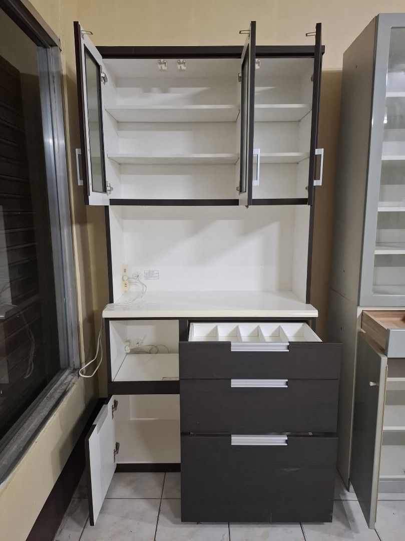 Kitchen Cupboard Display Hutch Cabinet (Category: Shelves, Cabinets & Racks) located in Quezon City. Submitted by dannikkishoppe2 (Listing ID 1463748971, Image 2). Description: Kitchen Cupboard Display Hutch Cabinet‼️₱10000‼️ ✔️ With pull out shelf and built-in outlet for microwave, rice cooker, or other appliances Please manage your expectations as there might be minimal flaws. Color may vary due to lighting, it may appear darker or lighter in p