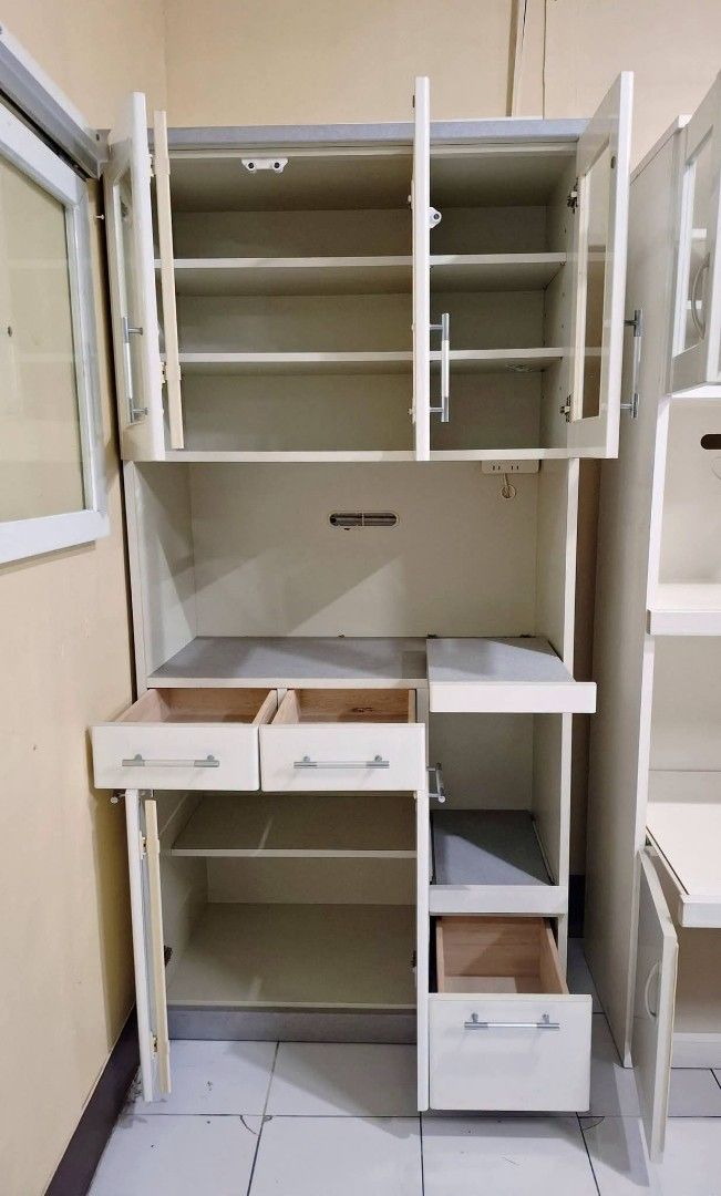 Kitchen Display Cupboard Hutch Cabinet (Category: Shelves, Cabinets & Racks) located in Quezon City. Submitted by dannikkishoppe2 (Listing ID 1463746869, Image 2). Description: Kitchen Display Cupboard Hutch Cabinet‼️₱11000‼️ *with built-in outlet for microwave, rice cooker, or other appliances *solid wood, compressed wood, glass doors, plyboard materials *2-piece cabinet Please manage your expectations as there might be minimal flaws. Color may 