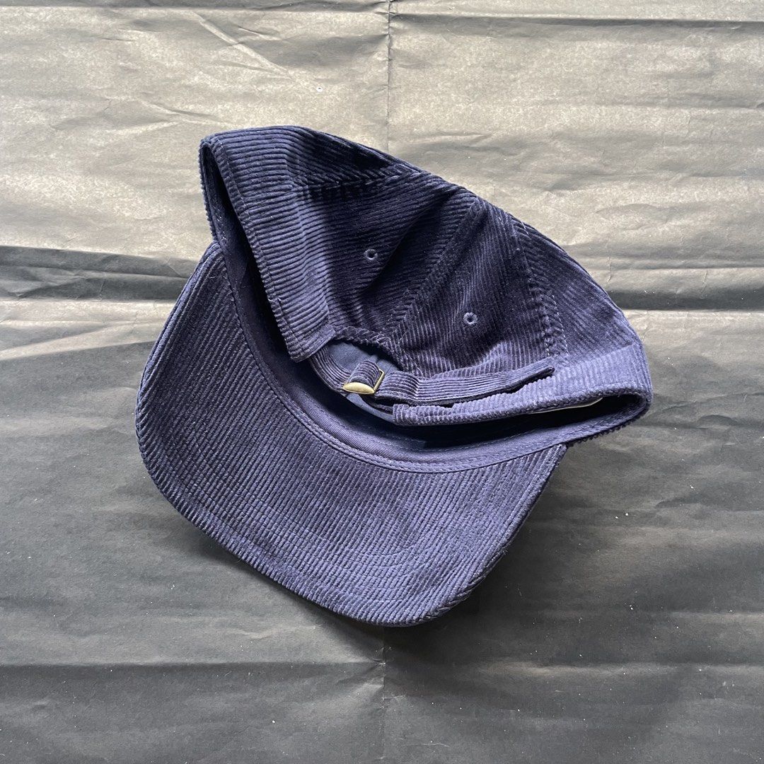 Kith Corduroy Cap Navy Blue (Category: Caps & Hats) located in Manila. Submitted by sydge_ (Listing ID 1463780987, Image 2). Description: - Navy blue corduroy cap from Kith - Features embroidered Kith logo on the front - Adjustable strap at the back for a custom fit - Classic dad hat style - Ideal for everyday wear.