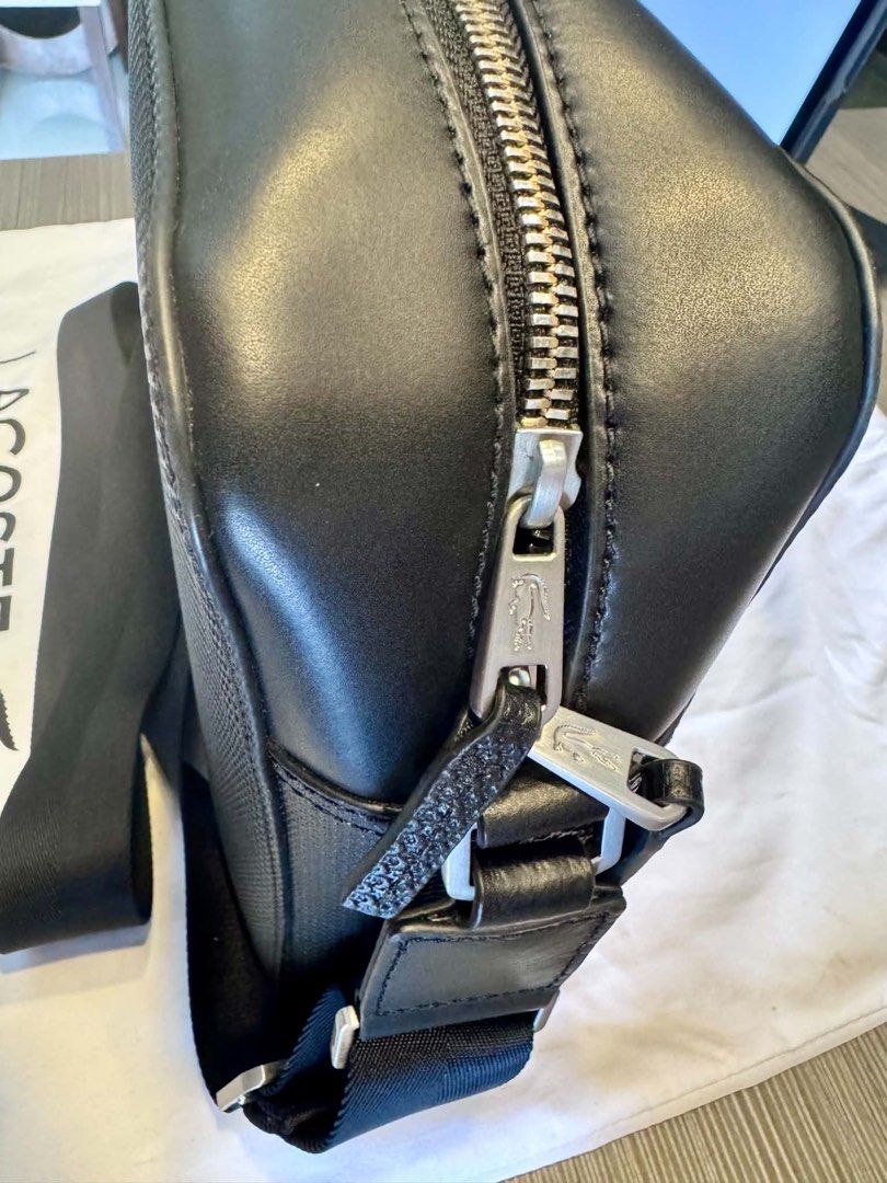 Lacoste Chantaco Bag (Category: Sling Bags) located in Manila. Submitted by tarahlito45496 (Listing ID 1463896434, Image 3). Description: PERSONAL ITEM: Lacoste chantaco shoulder/messenger bag With Dust Bag With Shoulder strap ✨AUTHENTIC✨ Size: Length - Approx. 12.6” or 32cm Height - Approx 9.06” or 23cm 📍QC AREA.