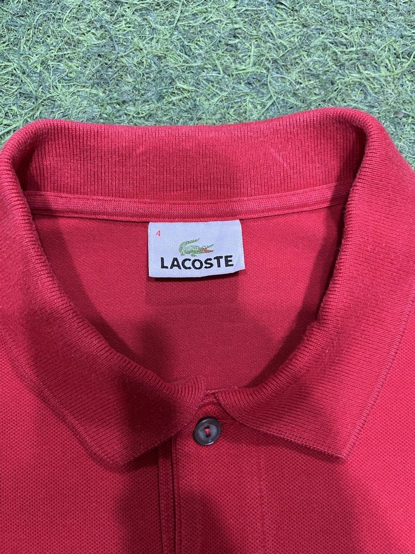 Lacoste Red Polo Shirt Size 4 (Category: Tshirts & Polo Shirts ) located in Balamban. Submitted by gogochrist09668 (Listing ID 1463894585, Image 3). Description: - Classic red Lacoste polo shirt - Iconic embroidered crocodile logo on chest - Two-button placket with grey buttons - Size: 4 19W 25L - Material: Comfortable cotton - Style: Great for casual or smart-casual looks.