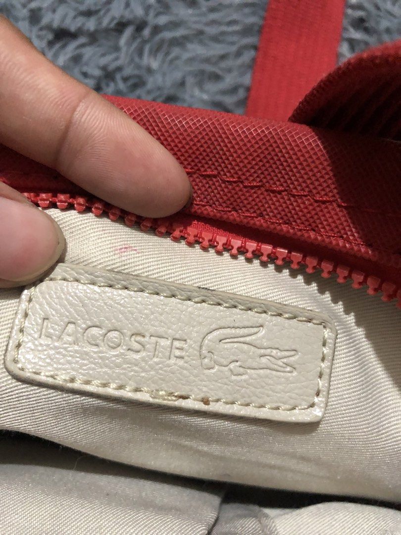 LACOSTE Sling Bag Red Color (Category: Sling Bags) located in Manila. Submitted by raremountain00 (Listing ID 1463922775, Image 3). Description: Good condition Issue minimal lang check last picture.