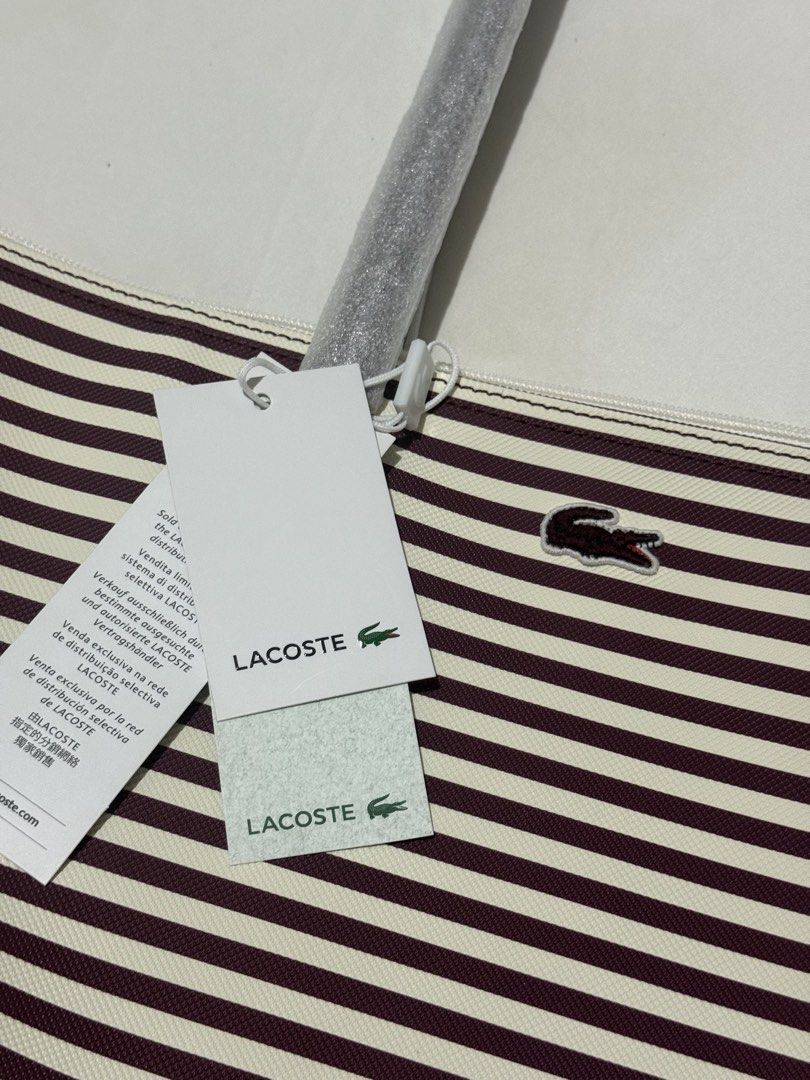 Lacoste Striped Large Tote Bag Espresso (Category: Tote Bags) located in Pasig City. Submitted by lovedbyrtc (Listing ID 1463896618, Image 2). Description: US bought Dark red/ dark magenta/plum in personal.