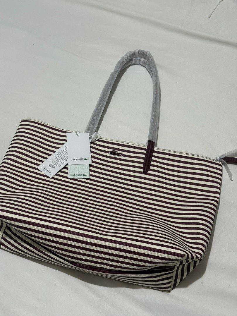 Lacoste Striped Large Tote Bag Espresso (Category: Tote Bags) located in Pasig City. Submitted by lovedbyrtc (Listing ID 1463896618, Image 1). Description: US bought Dark red/ dark magenta/plum in personal.