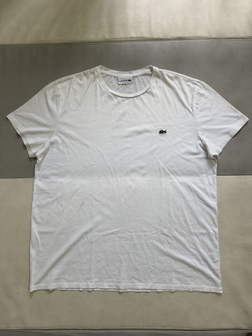 Lacoste White T-Shirt for men’s (Category: Tshirts & Polo Shirts ) located in Quezon City. Submitted by vaniefiel (Listing ID 1463780445, Image 1). Description: For Sale! Authentic - Lacoste t-shirt - Iconic green crocodile logo embroidered on chest - Made from 100% cotton for ultimate comfort - Regular fit for a comfortable silhouette - Tag indicates origin from Hong Kong - issue pinhole upper left shoulder - Check pictures for actual size dimen