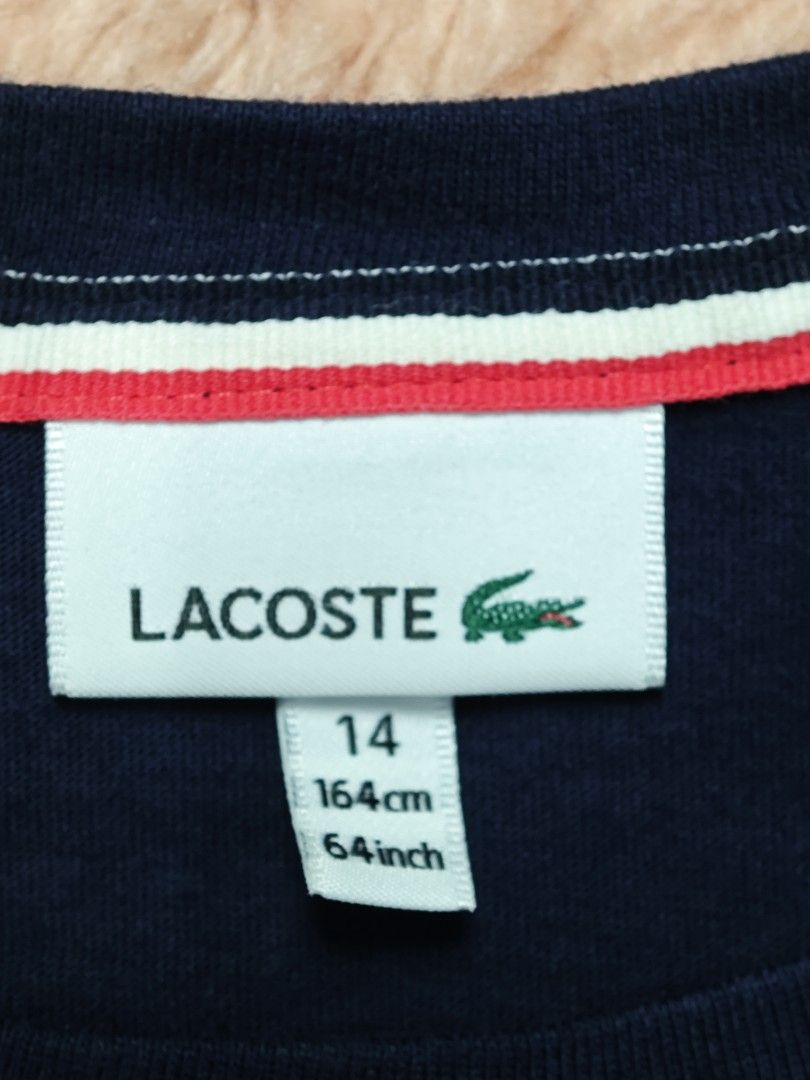 Lacoste Youth Tee Navy Blue (Category: Babies & Kids Fashion) located in Imus. Submitted by eykc01 (Listing ID 1463878084, Image 2). Description: Excellent to Like New 14 on tag Armpit to armpit: 17.5" Length: 24".