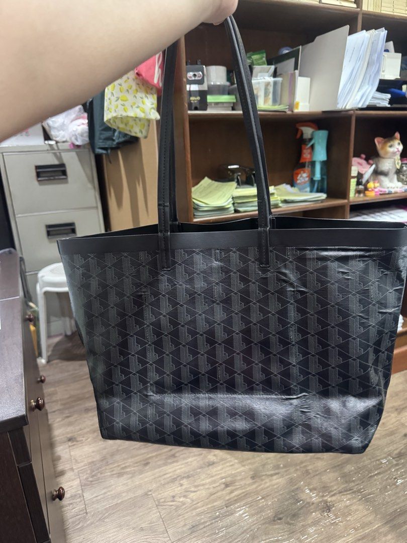 Lacoste zely tote bag (Category: Tote Bags) located in Valenzuela. Submitted by Pinkantshoppe (Listing ID 1463833307, Image 1). Description: - Pls manage your expectation, this is a preloved item - don't offer kung hindi nmn kukunin pls. - Classic black tote bag - Repeating geometric monogram pattern - Genuine leather handles and trim - Spacious interior, ideal for everyday or travel - Simple and timeless design.