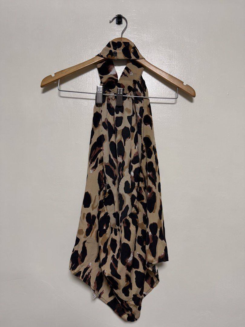 Leopard Print Halter Neck Top (Category: Sleeveless) located in Manila. Submitted by don_p (Listing ID 1463867763, Image 1). Description: - Adorable halter neck top - Fun and trendy leopard print - Lightweight fabric that drapes beautifully - Features a convenient tie at the back of the neck - Versatile for casual day or night out looks - Pairs perfectly with jeans or shorts.