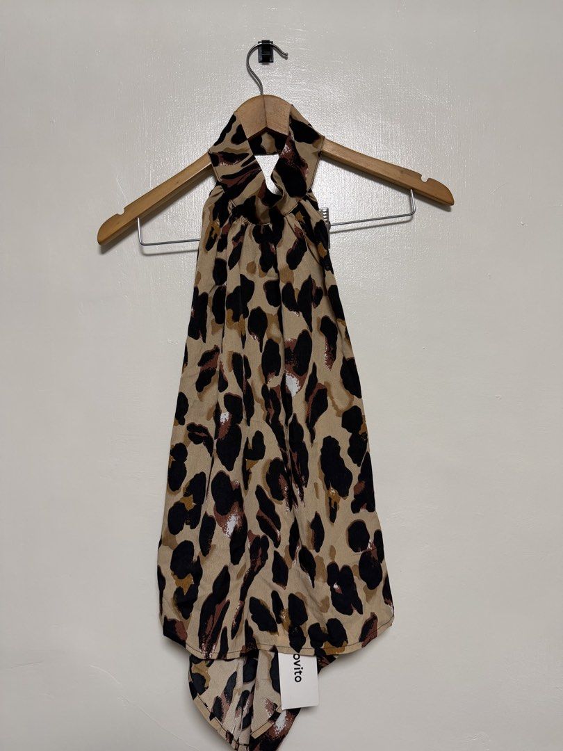 Leopard Print Halter Neck Top (Category: Sleeveless) located in Manila. Submitted by don_p (Listing ID 1463867763, Image 2). Description: - Adorable halter neck top - Fun and trendy leopard print - Lightweight fabric that drapes beautifully - Features a convenient tie at the back of the neck - Versatile for casual day or night out looks - Pairs perfectly with jeans or shorts.