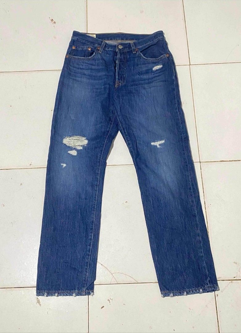 Levi's 501 Premium Big E buttonfly pants (Category: Jeans) located in Maasin. Submitted by trippythirftyyy (Listing ID 1463872016, Image 2). Description: - Classic Levi's 501 jeans -authentic pair -size 27-28 -still in good shape - Blue denim with distressed front details - Button fly closure - premium - Ideal for everyday wear - Please check photos for exact condition.