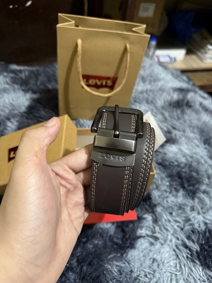 Levi's Reversible Belt with Buckle (Category: Belts) located in Manila. Submitted by adriyawnnn (Listing ID 1463928011, Image 1). Description: - Genuine Brown Levi's Belt - Reversible Design - Classic Metal Buckle - Detailed Stitching Along Edges - Comes with Original Box, Paper Bag, and Card - Versatile Accessory for Any Outfit.