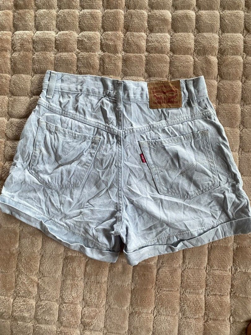 Levis Short (Category: Shorts) located in Santo Tomas. Submitted by liyothrift (Listing ID 1463936432, Image 2). Description: Light-wash Levi's women's A-line mom shorts featuring a high-rise waist and cuffed hem. width 26-28 Length 13 Good to excellent.
