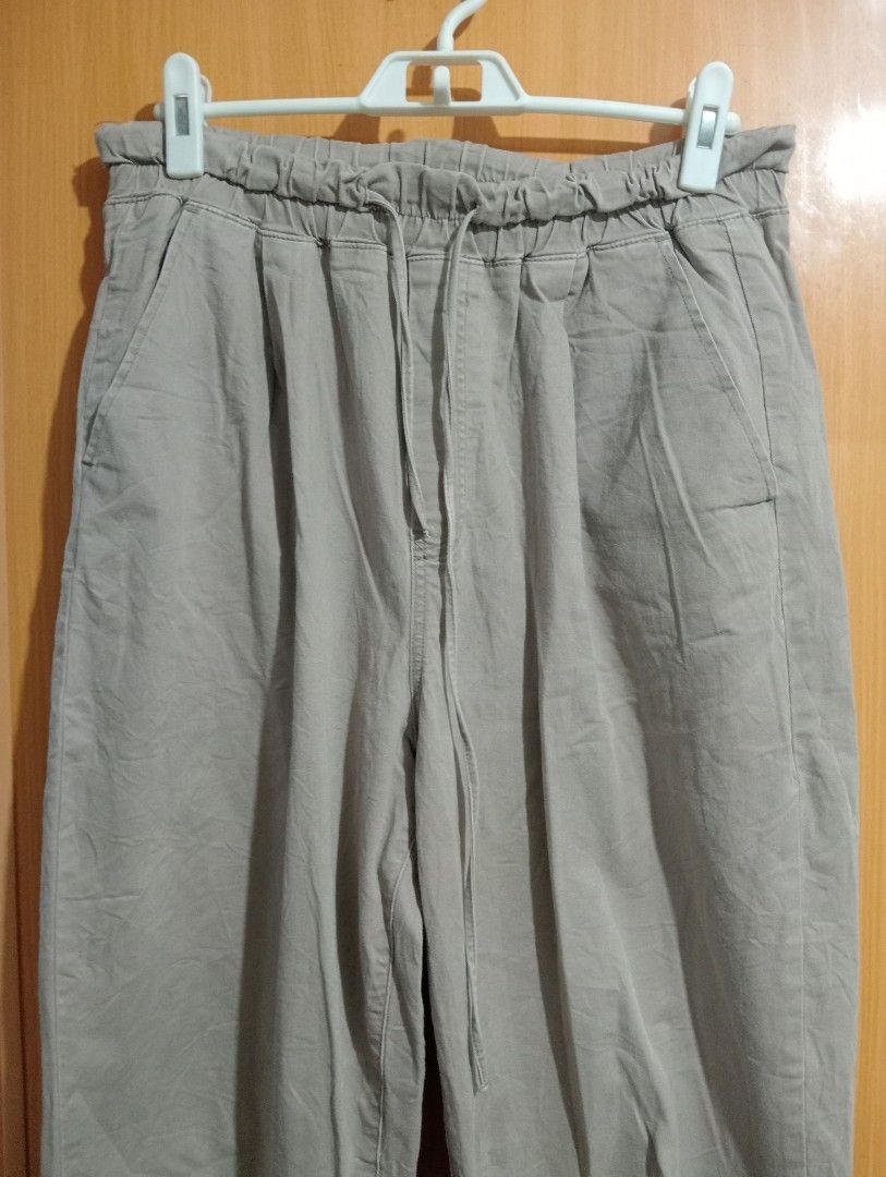 Light Beige Elastic Waist Drawstring Pants (Category: Trousers) located in Quezon City. Submitted by niceoutfits (Listing ID 1463742790, Image 3). Description: - Light beige color - Elastic waistband with drawstring - Relaxed fit - Cropped length - Two side pockets - Two back pockets - Comfortable cotton blend fabric - Ideal for casual wear.