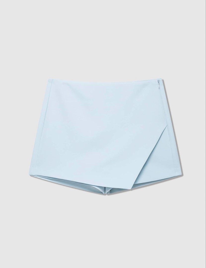 Light Blue Asymmetrical Skort (Category: Skirts) located in Bulacan. Submitted by prelovedbylei (Listing ID 1463936584, Image 1). Description: - Light blue skort - Asymmetrical front overlay - Side zipper closure RFS: Ordered the wrong size.