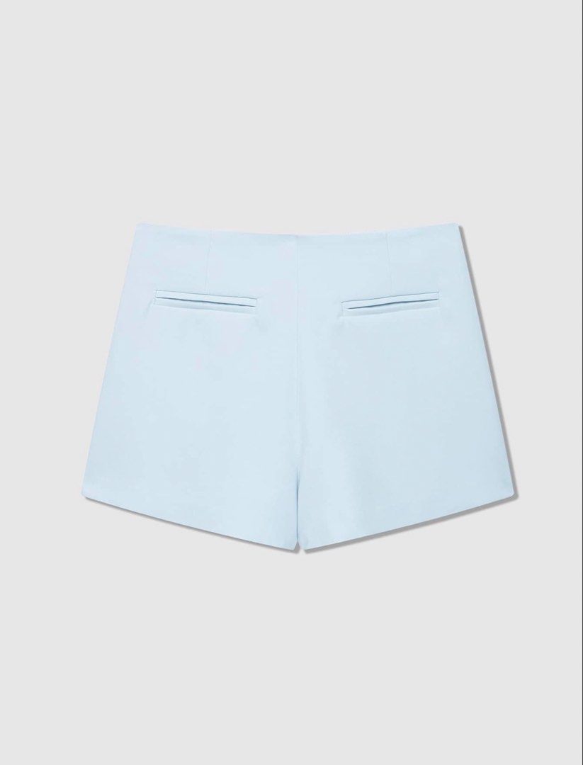 Light Blue Asymmetrical Skort (Category: Skirts) located in Bulacan. Submitted by prelovedbylei (Listing ID 1463936584, Image 2). Description: - Light blue skort - Asymmetrical front overlay - Side zipper closure RFS: Ordered the wrong size.