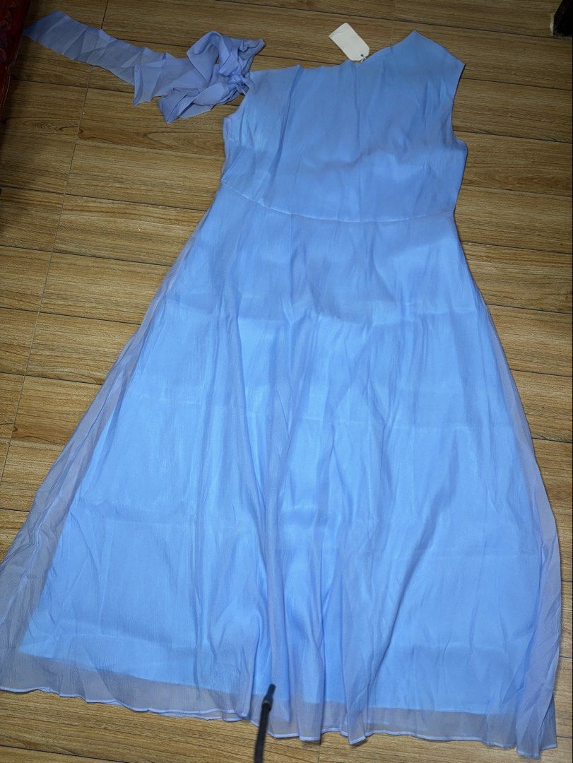 Light blue long formal gown (Category: Dresses) located in Taytay. Submitted by murahubblueapppage (Listing ID 1463931382, Image 2). Description: a light blue one-shoulder long formal gown featuring a ruffled shoulder accent and a flowing overlay skirt. Xl on tag waistline: up to 38 inches Bust:up to 42 inches Long: 59 inches long from shoulder Can book asap: store pin: murahub.