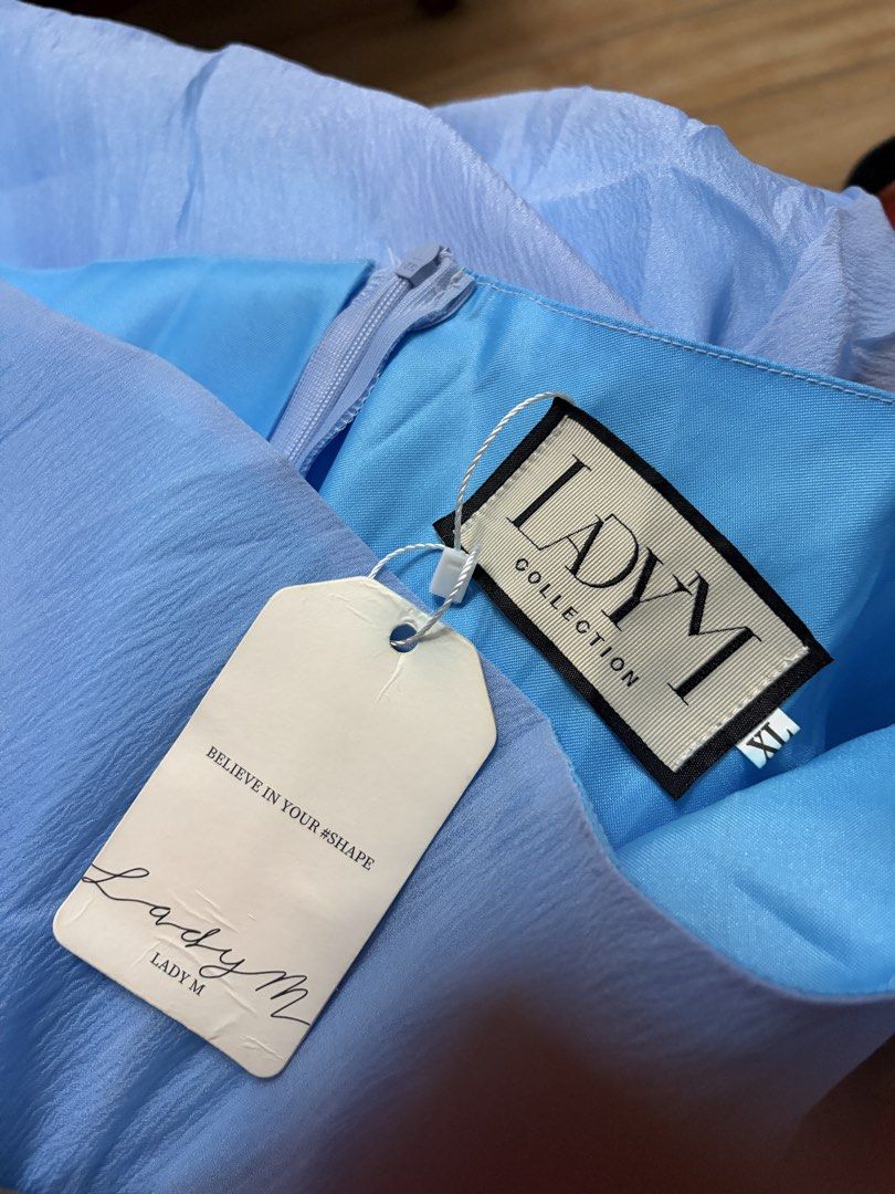 Light blue long formal gown (Category: Dresses) located in Taytay. Submitted by murahubblueapppage (Listing ID 1463931382, Image 3). Description: a light blue one-shoulder long formal gown featuring a ruffled shoulder accent and a flowing overlay skirt. Xl on tag waistline: up to 38 inches Bust:up to 42 inches Long: 59 inches long from shoulder Can book asap: store pin: murahub.