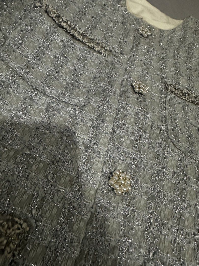 Light Grey Tweed Jacket with Pearl Buttons (Category: Coats, Jackets and Outerwear) located in Manila. Submitted by everythingsale101 (Listing ID 1463762076, Image 3). Description: - Chic light grey tweed jacket - Elegant pearl button details - Stylish decorative pocket flaps - Flattering round neckline - Effortlessly dress up or down - Ideal for layering - Perfect for spring and fall weather Fits M-L up to 36 bust —Premium Tweed Blazers & Jacket