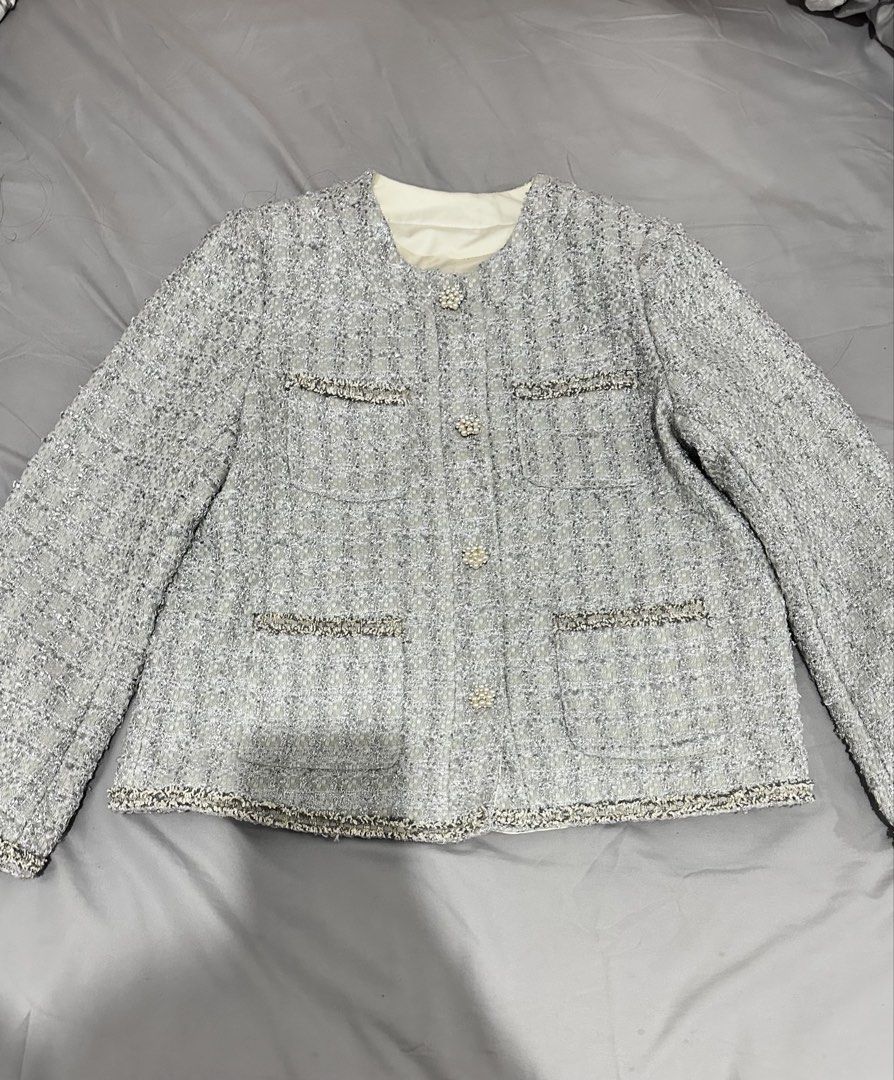 Light Grey Tweed Jacket with Pearl Buttons (Category: Coats, Jackets and Outerwear) located in Manila. Submitted by everythingsale101 (Listing ID 1463762076, Image 1). Description: - Chic light grey tweed jacket - Elegant pearl button details - Stylish decorative pocket flaps - Flattering round neckline - Effortlessly dress up or down - Ideal for layering - Perfect for spring and fall weather Fits M-L up to 36 bust —Premium Tweed Blazers & Jacket