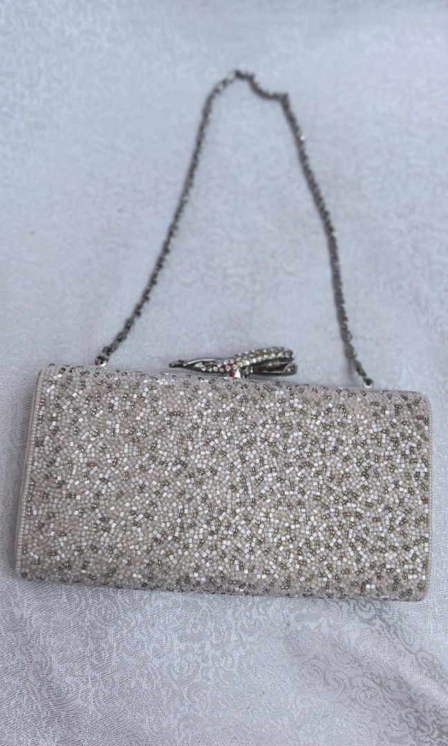 Like New Beaded clutch with chain (Category: Clutches) located in Tuguegarao City. Submitted by zenphoenix-7ad615 (Listing ID 1463869007, Image 1). Description: Prettt clutch bag Beaded With minimal dirt only.
