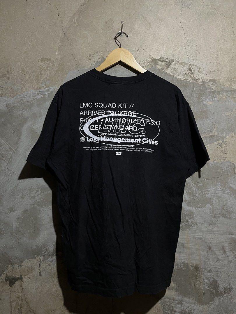 LMC Lost Management Cities Black T-shirt (Category: Tshirts & Polo Shirts ) located in Manila. Submitted by rylthriftz12 (Listing ID 1463893436, Image 2). Description: - Black LMC t-shirt - Blue and white graphic logo with 'LOST MANAGEMENT CITIES' text - Short sleeves - Crew neck - Red tag detail on the side - Ideal for casual wear.