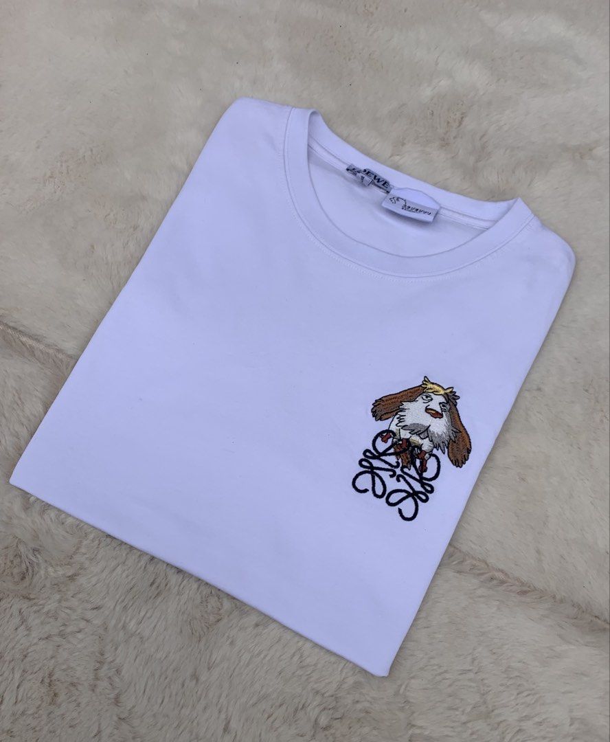 LOEWE x Studio Ghibli White T-shirt (Category: Shirts) located in Cateel. Submitted by janicegpad45049 (Listing ID 1463881314, Image 1). Description: - Authentic LOEWE x Studio Ghibli Collaboration T-Shirt - Color: White - Material: Soft Cotton - Features a cute Studio Ghibli embroidered graphic on the chest - Made in Portugal - Versatile: Pairs well with jeans or shorts - Ideal for fans of both LOEWE and Studio Ghibli.
