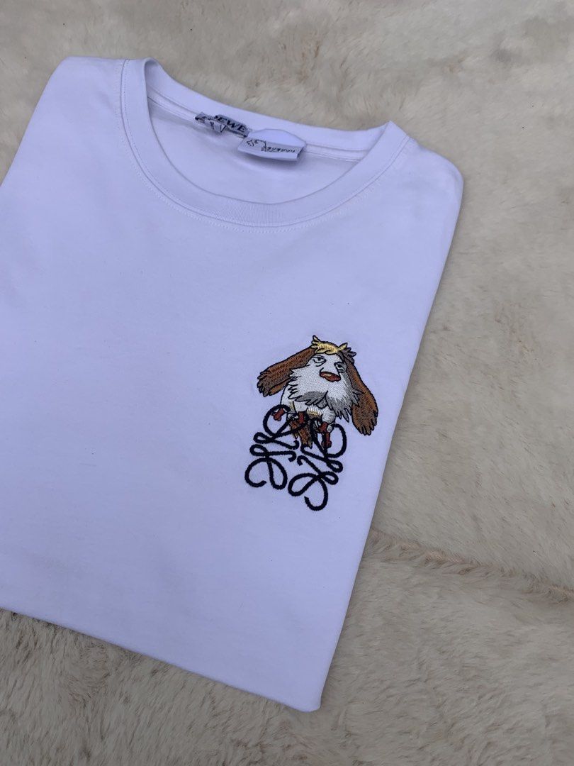 LOEWE x Studio Ghibli White T-shirt (Category: Shirts) located in Cateel. Submitted by janicegpad45049 (Listing ID 1463881314, Image 2). Description: - Authentic LOEWE x Studio Ghibli Collaboration T-Shirt - Color: White - Material: Soft Cotton - Features a cute Studio Ghibli embroidered graphic on the chest - Made in Portugal - Versatile: Pairs well with jeans or shorts - Ideal for fans of both LOEWE and Studio Ghibli.
