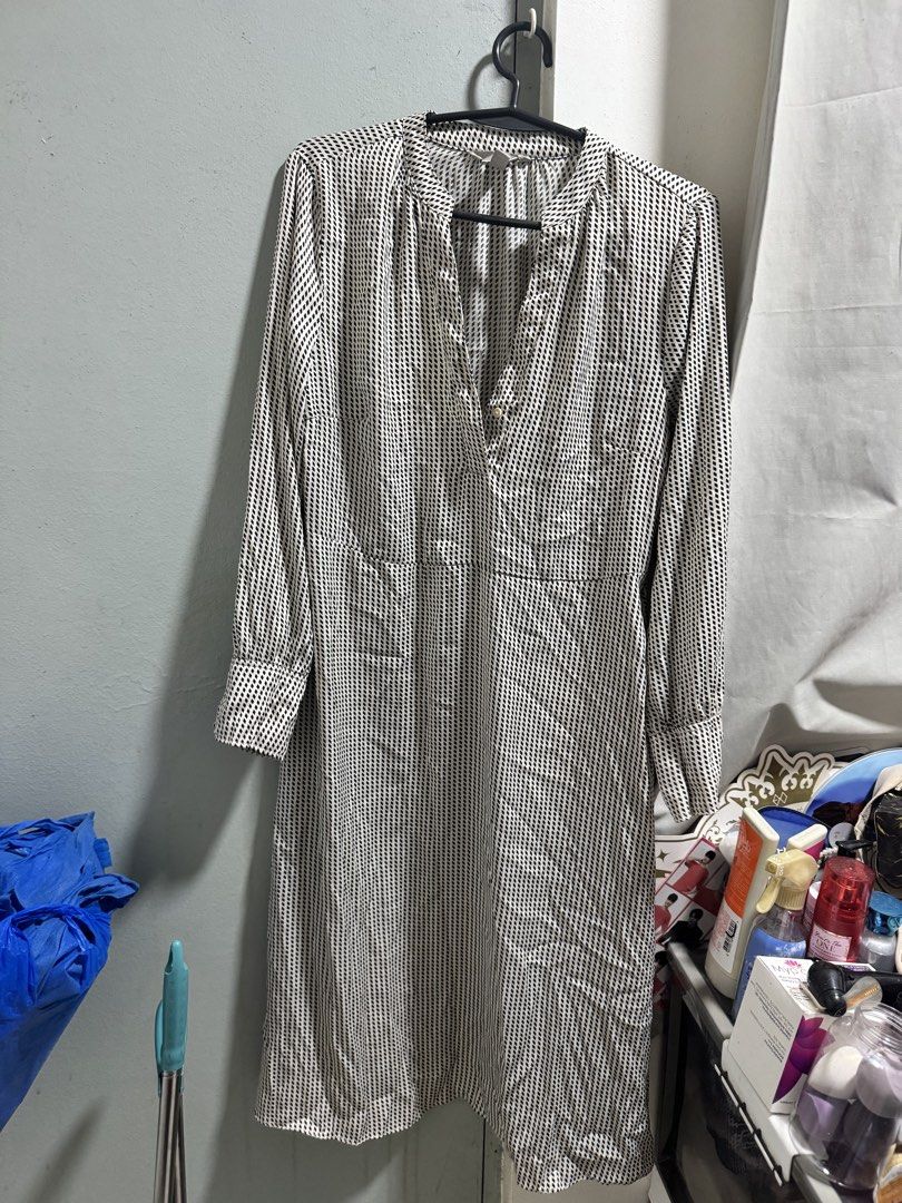 Long Sleeve Printed V-Neck Dress (Category: Dresses) located in Manila. Submitted by _aabbybimbap (Listing ID 1463901968, Image 2). Description: - Long-sleeved dress - V-neckline with tie-up detail - Small, vertical black and white print - Cinched waist for a flattering silhouette - Functional buttons down the front - Versatile for everyday wear, easily dressed up or down.