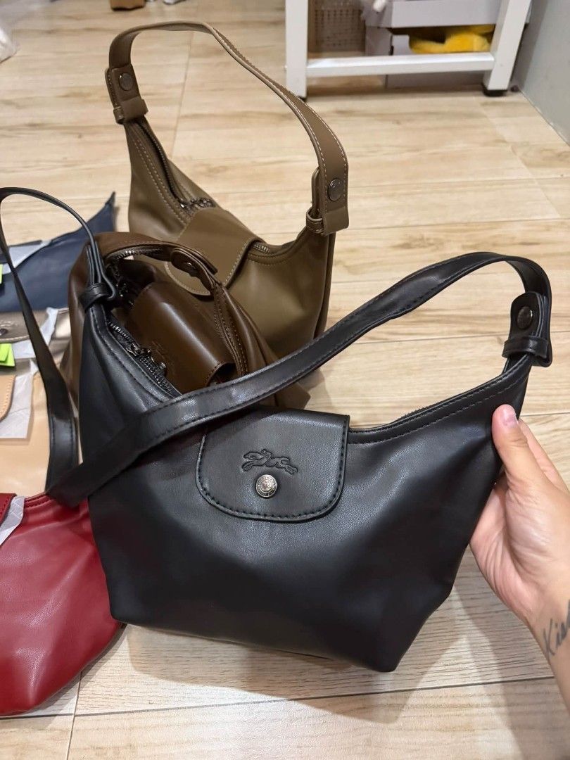 Longchamp 3in1 leather bag- Multiple Colors Available (Category: Luxury Bags & Wallets) located in Manila. Submitted by cherylbela18304 (Listing ID 1463858079, Image 3). Description: - Classic Longchamp hobo bag - Zip-top closure with snap button flap - Adjustable shoulder strap for comfort - Available in multiple popular colors - Ideal for everyday use, carrying essentials.