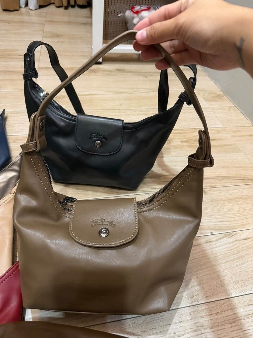 Longchamp 3in1 leather bag- Multiple Colors Available (Category: Luxury Bags & Wallets) located in Manila. Submitted by cherylbela18304 (Listing ID 1463858079, Image 2). Description: - Classic Longchamp hobo bag - Zip-top closure with snap button flap - Adjustable shoulder strap for comfort - Available in multiple popular colors - Ideal for everyday use, carrying essentials.