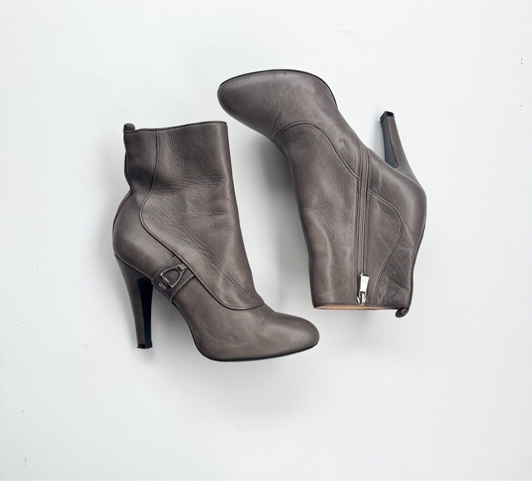 LongChamp Ankle Boots with Buckle Detail (Category: Boots) located in Davao. Submitted by LUXURY (Listing ID 1463817023, Image 1). Description: Longchamp chic grey leather ankle boots with a side zipper, pointed toe, and stiletto heel. Features a subtle buckle detail. Perfect for any outfit! Size 36.5 Pair only Visit my profile for more luxury items.