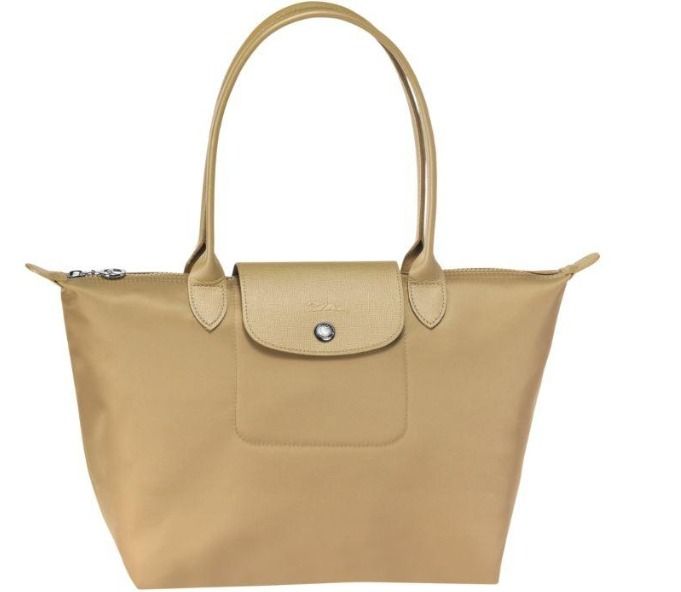 Longchamp Le Pliage Tote Bag (Category: Tote Bags) located in Cainta. Submitted by ysabel_star (Listing ID 1463809004, Image 1). Description: - Classic Longchamp tote bag - Gold color - Medium size - Durable nylon body with leather trim and handles - Secure zipper closure with snap-button flap - Spacious interior - Foldable for easy storage - Ideal for everyday use.