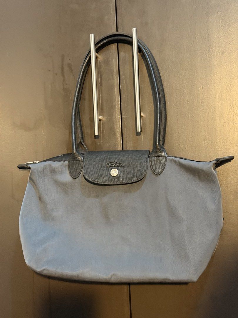 Longchamp Le Pliage Tote Bag Grey (Category: Luxury Bags & Wallets) located in Manila. Submitted by jlcvinci (Listing ID 1463880267, Image 1). Description: - Classic grey Longchamp tote bag - Genuine leather handles and trim - Secure zipper closure with snap tab - Spacious interior for everyday essentials - Versatile and timeless design.