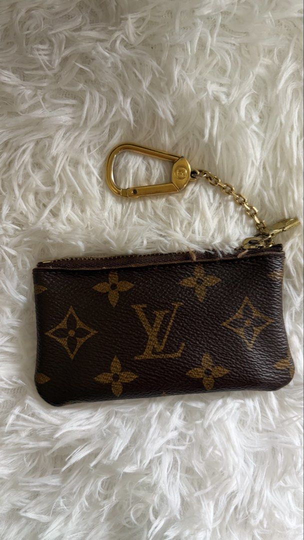 Louis Vuitton Monogram Canvas Coin Pouch with Keychain (Category: Luxury Bags & Wallets) located in Dumaguete. Submitted by freshcornerbyyeng (Listing ID 1463785726, Image 3). Description: - Authentic Louis Vuitton monogram coin pouch - Features a classic monogram canvas - Includes a stylish gold-tone keychain - Secure zipper closure - Ideal for organizing coins, cards, and small essentials - Compact and chic accessory.