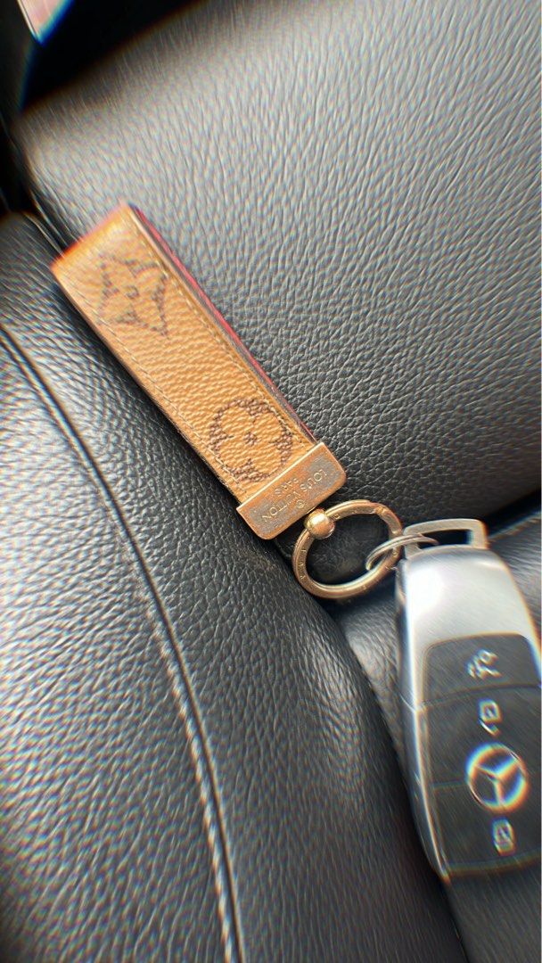 Louis Vuitton Monogram Canvas Keychain Charm (Category: Luxury Accessories) located in Manila. Submitted by minkss (Listing ID 1463809432, Image 1). Description: - Authentic Louis Vuitton keychain charm - Classic monogram canvas - Gold-tone ring and hardware - Perfect for keys or bags - Shows some signs of wear on canvas and hardware.