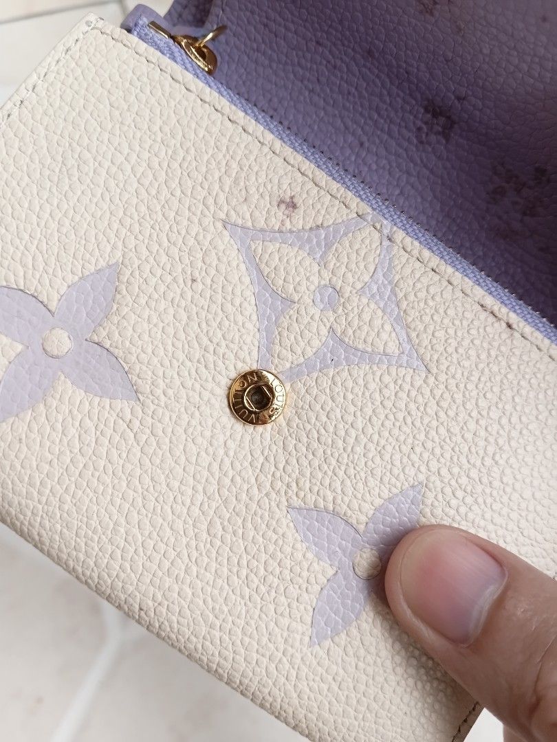 Louis Vuitton Monogram Mini Wallet (Category: Luxury Bags & Wallets) located in Manila. Submitted by grandflower-547aee (Listing ID 1463783612, Image 2). Description: - Authentic Louis Vuitton Mini Wallet - Classic Monogram Pattern (Pastel Shade) - Interior: Lilac Color - Closure: Snap and Zip Compartment - Made in France - Condition: Minor marks inside (please check photos).