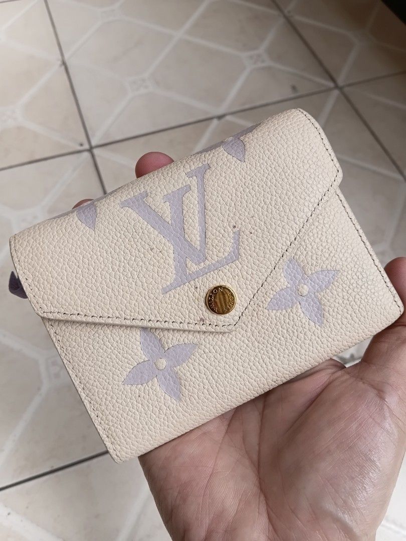 Louis Vuitton Monogram Mini Wallet (Category: Luxury Bags & Wallets) located in Manila. Submitted by grandflower-547aee (Listing ID 1463783612, Image 1). Description: - Authentic Louis Vuitton Mini Wallet - Classic Monogram Pattern (Pastel Shade) - Interior: Lilac Color - Closure: Snap and Zip Compartment - Made in France - Condition: Minor marks inside (please check photos).