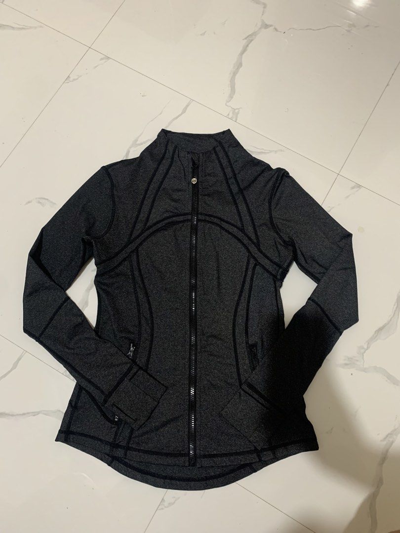 Lululemon Athletica Grey Zip-Up Jacket (Category: Coats, Jackets and Outerwear) located in Bayombong. Submitted by birkensaddiction (Listing ID 1463781101, Image 1). Description: - Grey Lululemon jacket Dot 6 - Full zip closure with stand-up collar - Thumbholes on sleeves - Two zippered front pockets - Lululemon logo on the back - Ideal for workouts and casual wear.